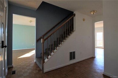 Wood parquet floors as you enter the home