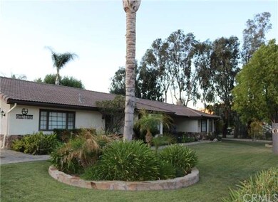 Meticulously maintained front gated landsacpe