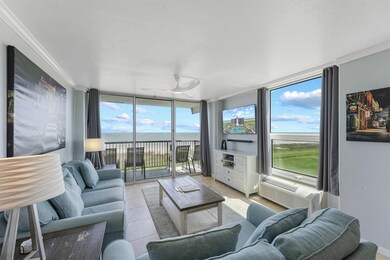This spacious open-concept living area is bathed i