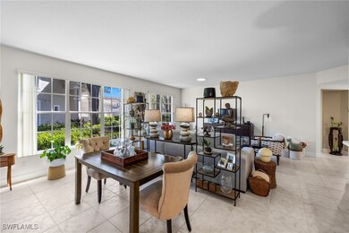 Dining area with light tile patterned floors and b