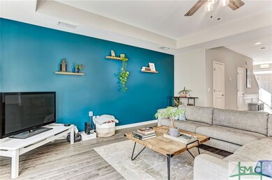Great room with tray ceiling and remote control fa