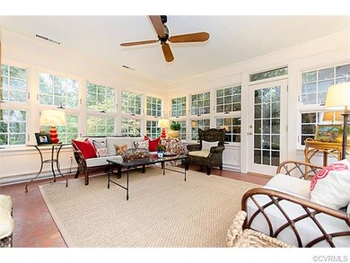 Florida Room w/terracotta tile floor & windows bri