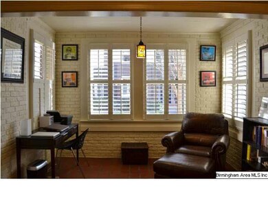 Exposed brick, room is awash in natural light. Hig