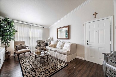 Living area with vaulted ceiling, ornamental moldi