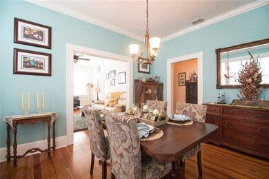 In the dining room, the baseboards and crown moldi