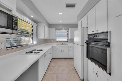 Bright and white kitchen offers great counter spac