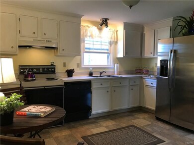 Fully applianced eat in kitchen.