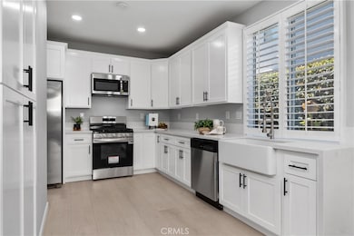 BRAND NEW KITCHEN! QUARTZ COUNTERTOP WITH WATERFULL EDGE, NEW CUSTOM SOFT CLOSE CABINETS, BRAND NEW SINK AND FAUCENT FIXTURE AND BRAND NEW APPLIANCES.