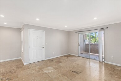 Empty room featuring crown molding, recessed light