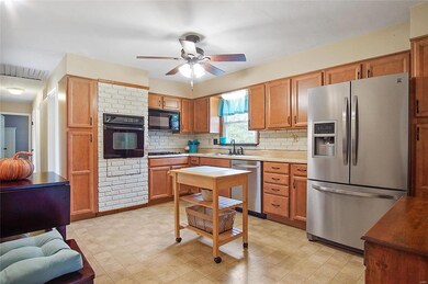 An ample amount of cabinets are available for storage.