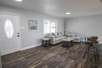 Living room featuring dark wood-type flooring