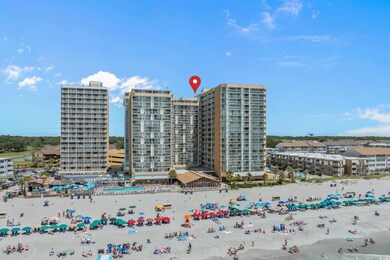 View of building exterior featuring view of local beach