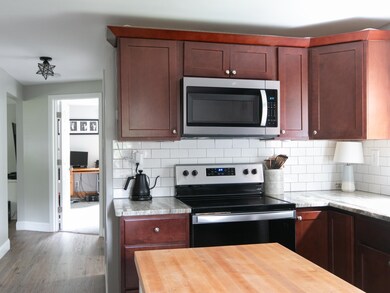 Notice the spacious hallway off the kitchen that l