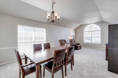 Front living room with vaulted ceilings and dining