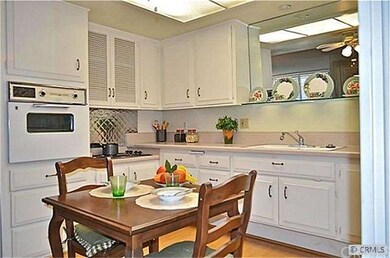 KITCHEN SPARKLES WITH CRISP WHITE CABINETRY.