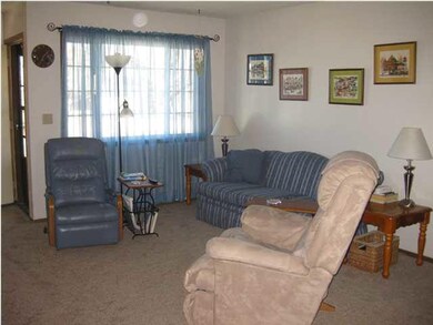 Open Gathering/Living Area with Large Picture wind