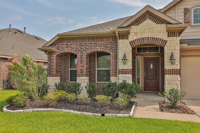 Beautiful stone front with outstanding brick design, windows and door archways with sitting porch.