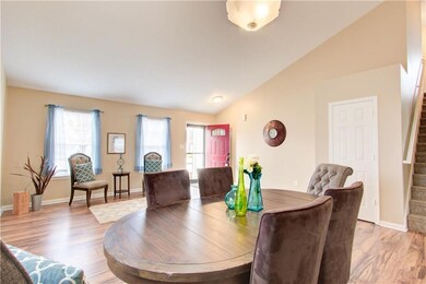 Upon entering, you will notice the tall vaulted ceiling, beautiful laminate floor and lots of great natural light.