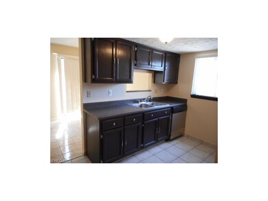 This kitchen features plenty of cabinets and count