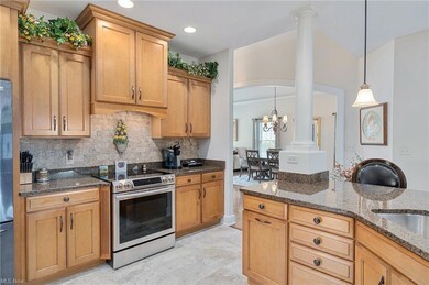 CUSTOM CABINETS AND STUNNING GRANITE COUNTERS ARE 
