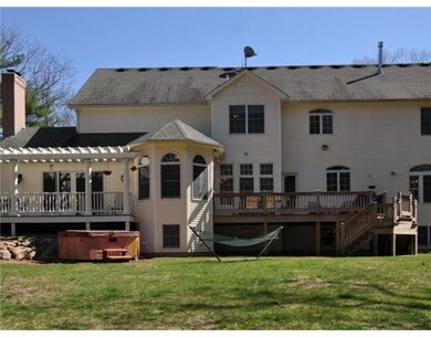 Exterior Back. Two decks with access to sunroom, f