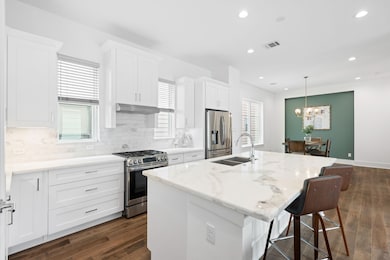 Chef's dream kitchen with marble countertops, cris