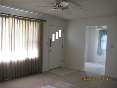 Living Room looking towards entry and into Dinette