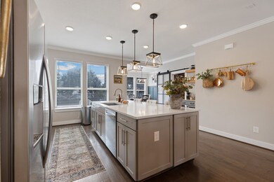 View from kitchen to breakfast area that opens to
