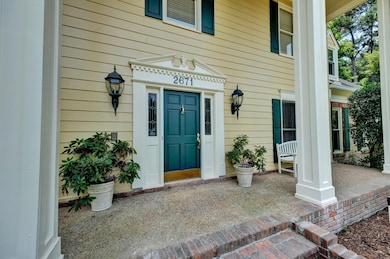 Entrance to property featuring covered porch