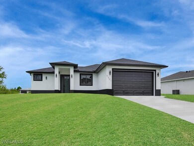Prairie-style house with concrete driveway, an att