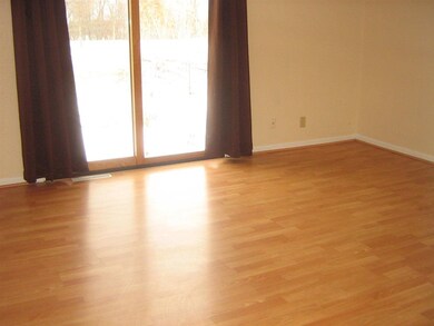 Sliding glass door in living room that leads to ce