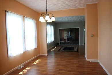 Dining room with large doorway opening to adjoinin