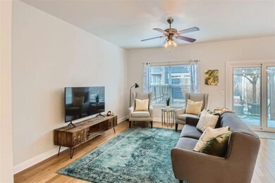 Living area with wood finished floors and ceiling