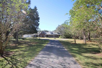 the road with 2 circle driveways.