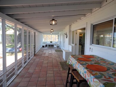 Screened Porch faces back yard