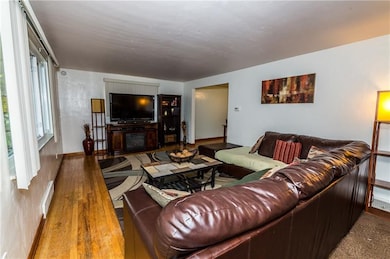 Large bright living room adjoins the kitchen and d