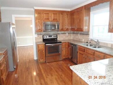 Bright kitchen with granite countertops, marble ba
