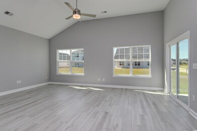 Spare room with ceiling fan, light wood-type flooring, and high vaulted ceiling