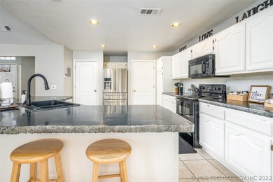 View of kitchen area from the dining area.  Access
