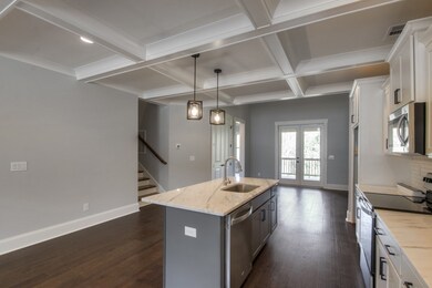 Pics are of the building next door. Floorplans are the same. Colors and finishes may vary. Finished pictures coming soon! 