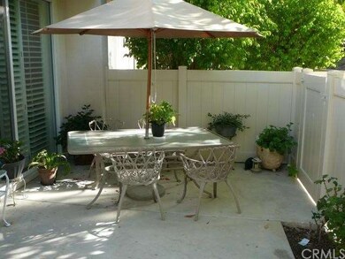 Private Patio with Vinyl Fence and Gate.