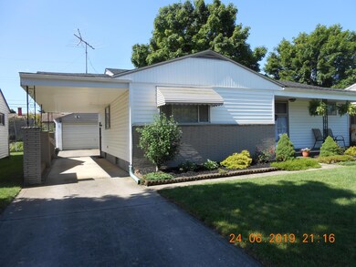 LARGE GARAGE PLUS CARPORT