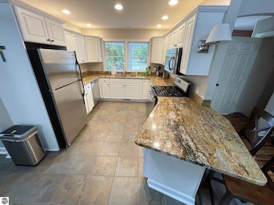 6417 E Harbor Dr, Elk Rapids, MI 49629 - photo 2