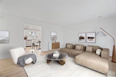 Living room with baseboards and light wood-type fl