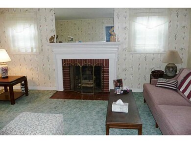 Living Room. With wood burning fireplace.