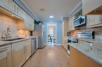 Updated kitchen with shaker cabinets, granite coun