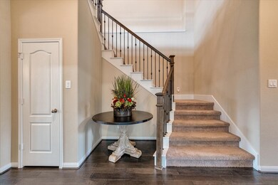 Here you will see the entry to the stairs with iron balusters, coat closet and a nice decorating nook.