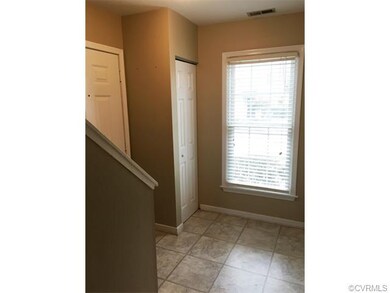 Bright foyer with coat closet