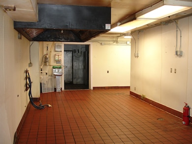 view of cook area with pizza hood vent