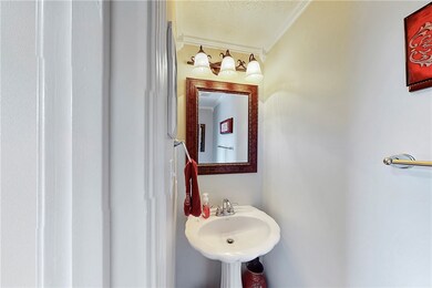A half bath is located privately and conveniently